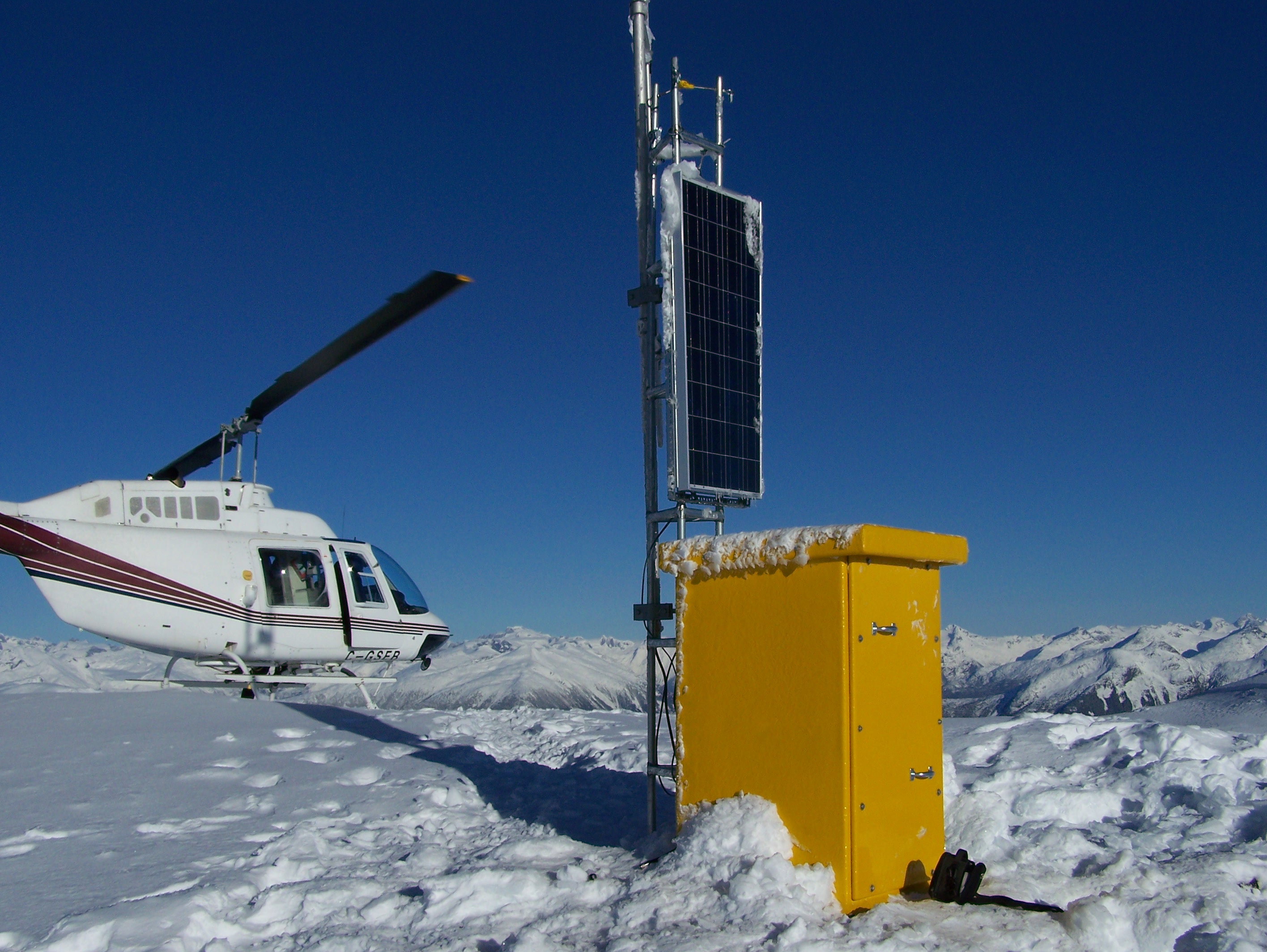 Helicopter and repeater installation at the summit of Mount Julian